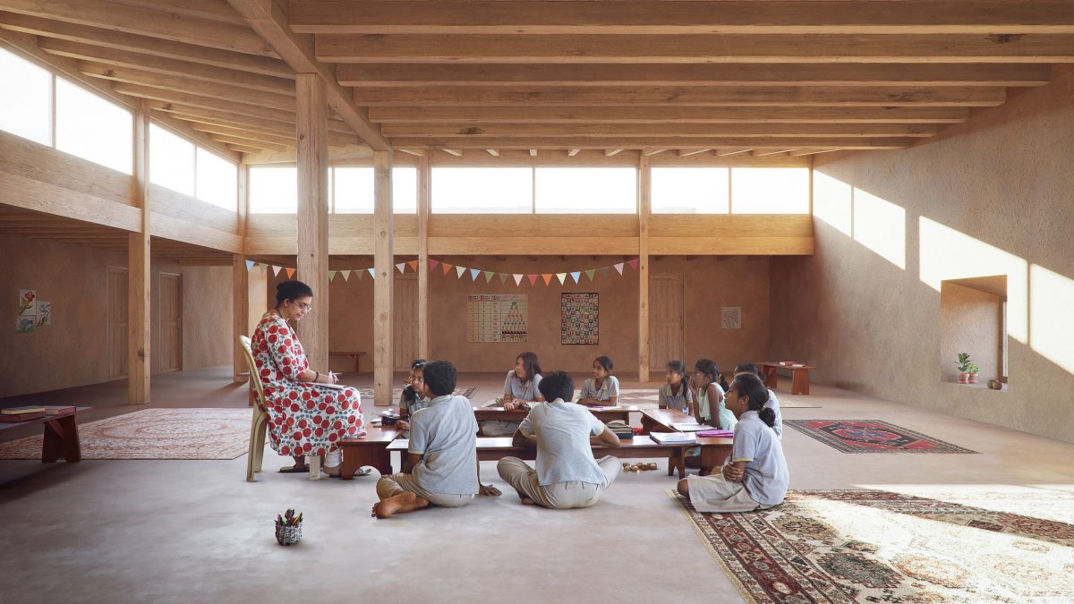 Lehrerin und Schüler im Innenraum mit der Ladakh Minimum School in Indien.